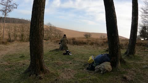 Packing away gear into the Osprey Atmos backpack March 2022