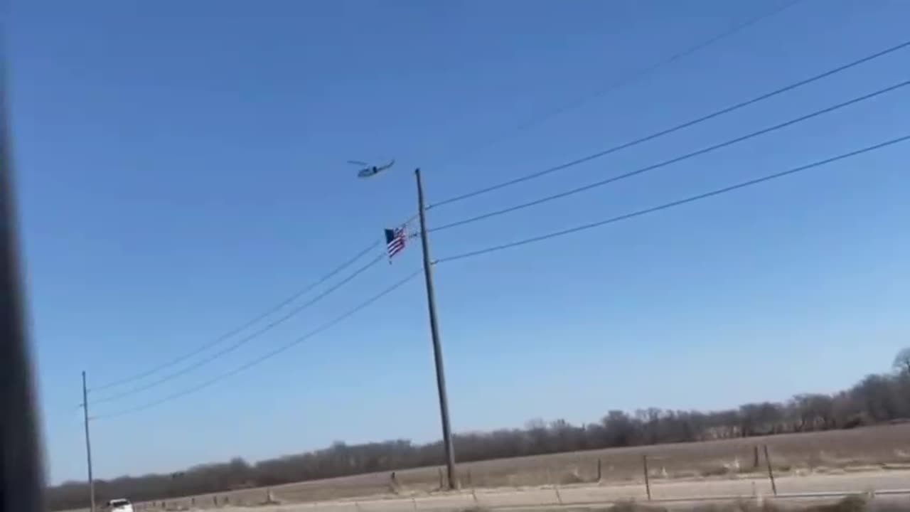 A helicopter carrying a large American