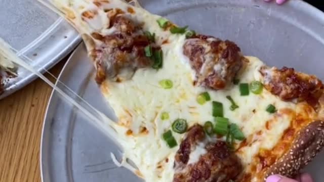 this extra cheesy K-POP MIC DROP PIZZA, served with chopsticks