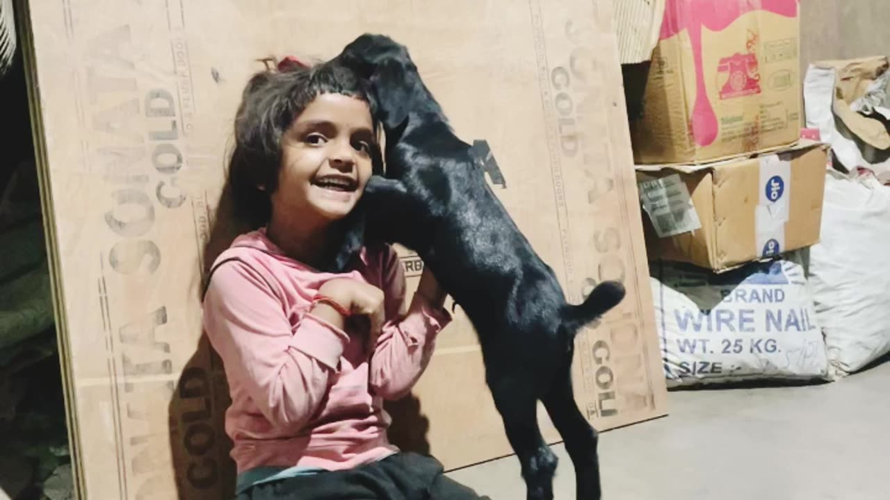 Adorable Moments: Children and a Baby Goat Enjoying Playtime Together