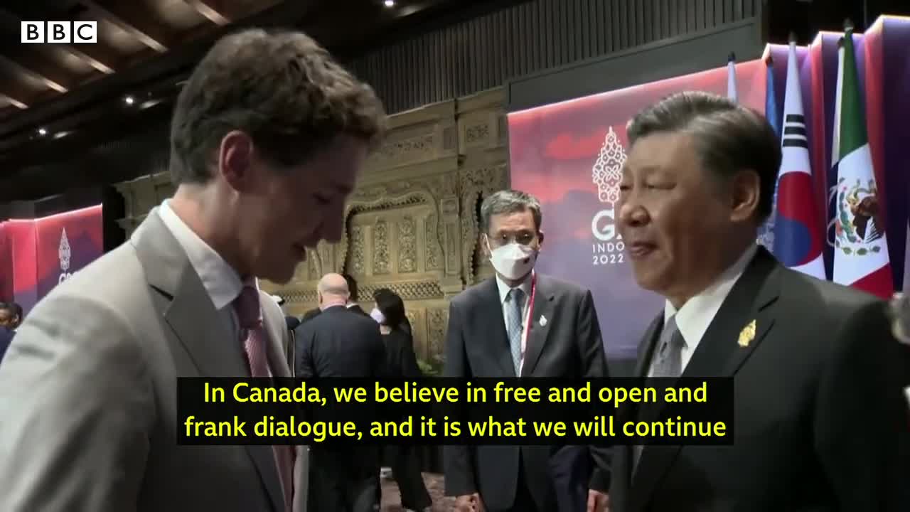 China and Canada leaders caught having tense exchange on camera - BBC News