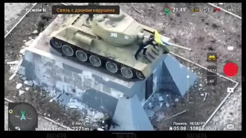 PMC Wagner fighters in Bakhmut near the monument with the T-34 tank on Gorky Street.