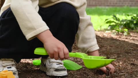 Kid playing in field