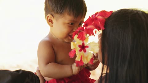 Small Baby playing with her mom