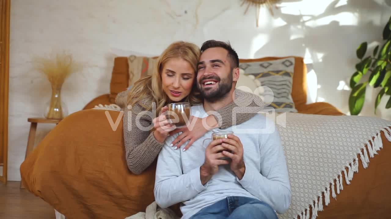 Lovely Couple Hugging In Bed On A Winter Day