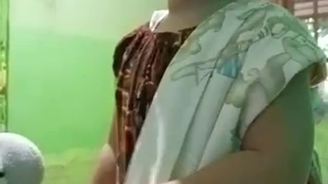 Inces plays with a zebra doll