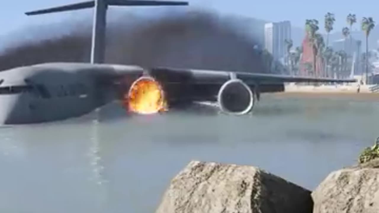 An engine fire forces a U.S. military transport plane to make an emergency landing on the beach