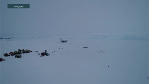 Landing of a heavy transport IL-76 on snow and ice in Antarctica near Progress station.