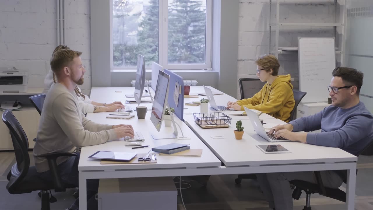 A Team of Coworkers in Office Works on Strategy