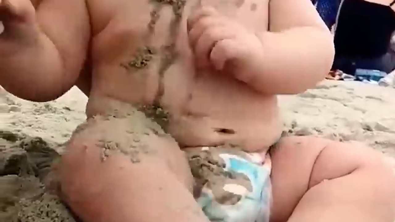 Funny baby reaction on beach