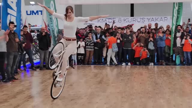 Girl Biker Performs