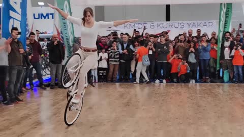 Girl Biker Performs