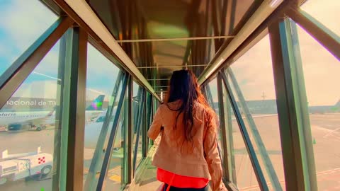 Woman Walking In A Jet Bridge