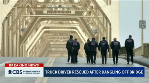 Driver rescued after wreck leaves big-rig dangling off Louisville bridge