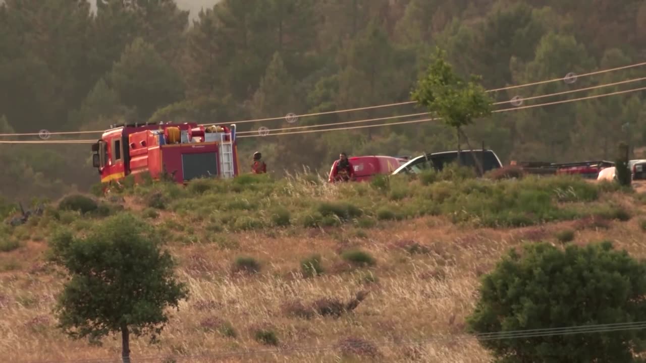 Wildfire burns into the night in western Spain