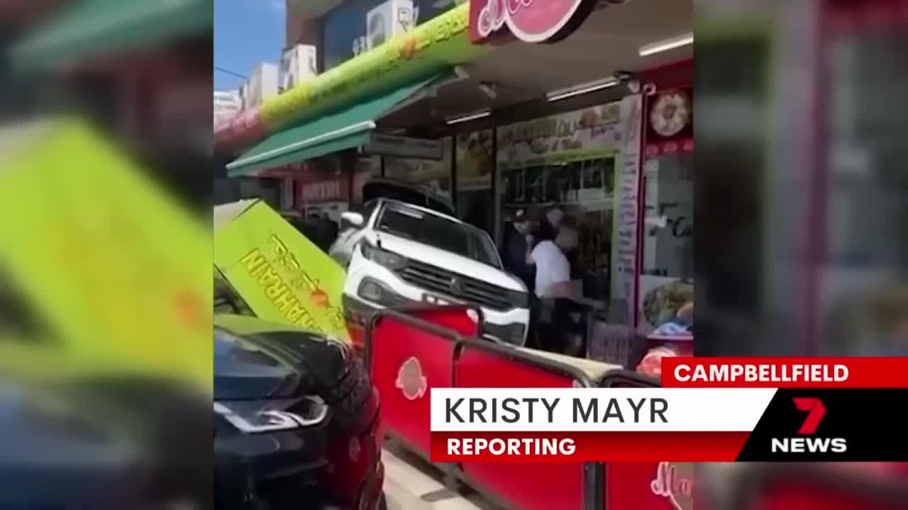 Driver crashes into shops trying to avoid arrest | 7NEWS