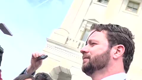 Dan Crenshaw walks out of the Capitol after voting to give Biden the power to shut down news sites