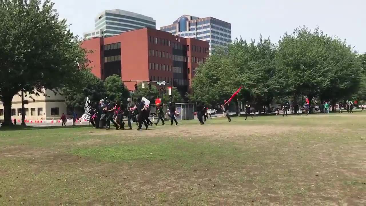 Aug 6 2017 Portland 1.1 Antifa cross the park to the gathering of the freedom march, drop kicked