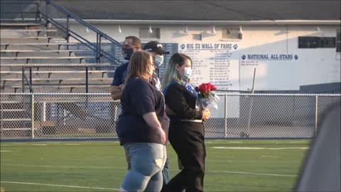 10-23-2020 - Chris And Lisa Walk Their Daughter Across The Field For Senior Night