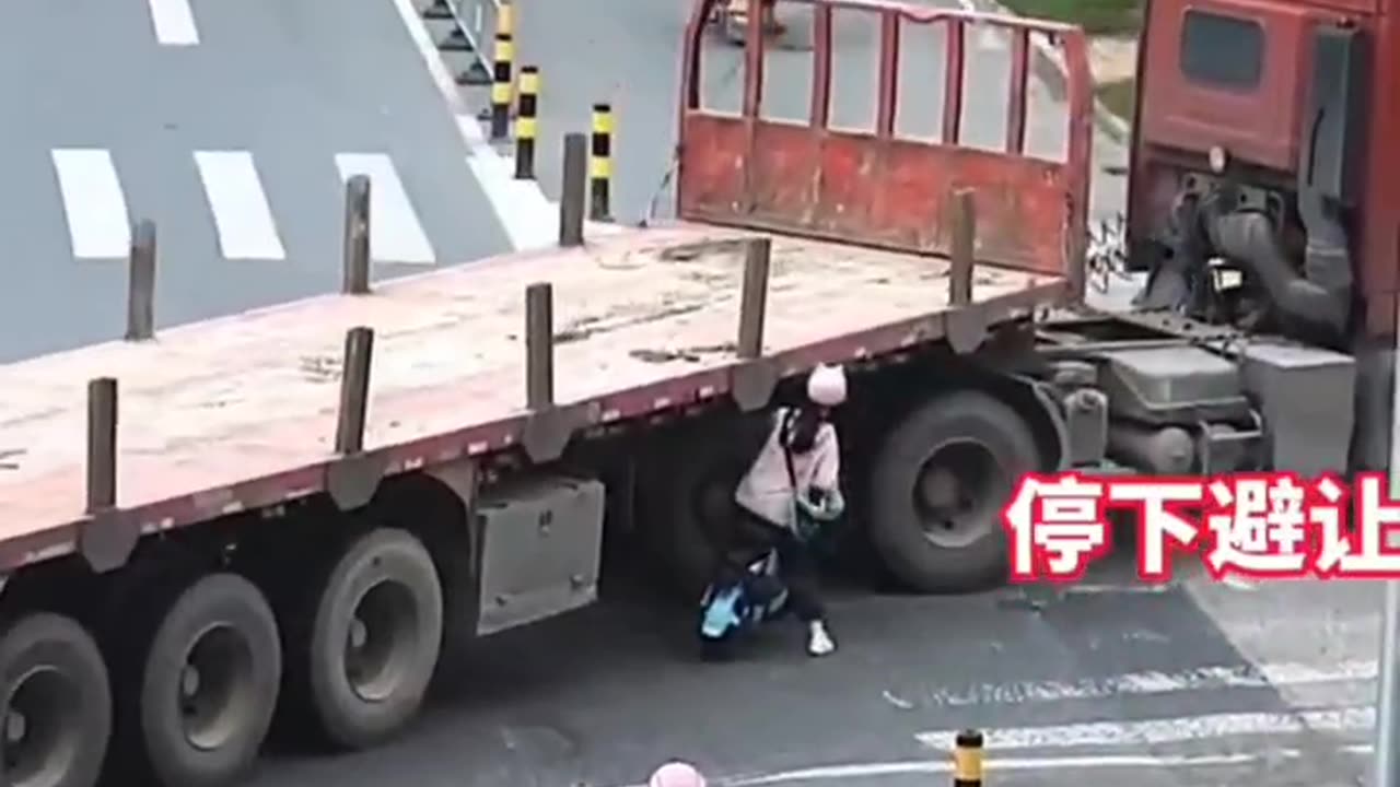 A girl was about to be crushed under a truck