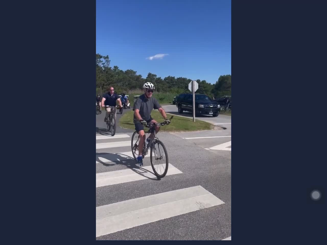 Joe Biden falls off his bicycle.