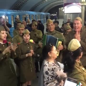 Russian soldiers sing "Katiyusha" (Katijusza) in a railway station
