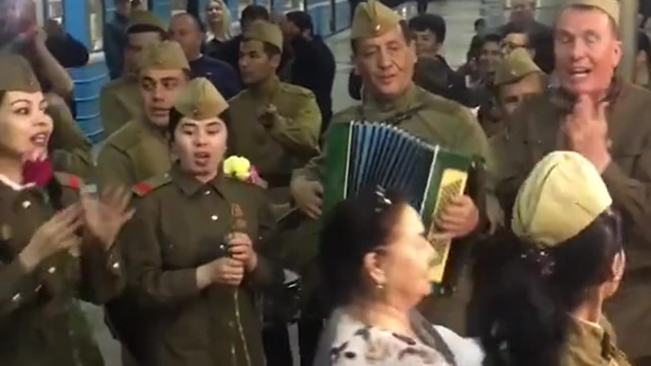 Russian soldiers sing "Katiyusha" (Katijusza) in a railway station