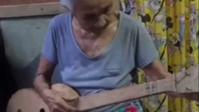 My 96 year old Grandmother sitting her ukulele.