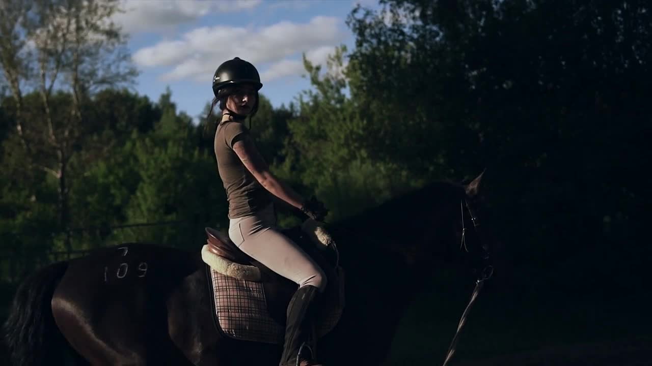 Beautiful girl learning to ride a horse