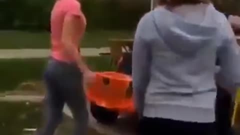 Girl hits other girl with a shovel