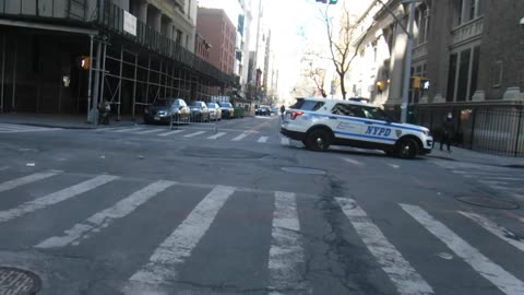 2022 0303 228 pm CIA NYPD 6580 cop checking his phone as I approach