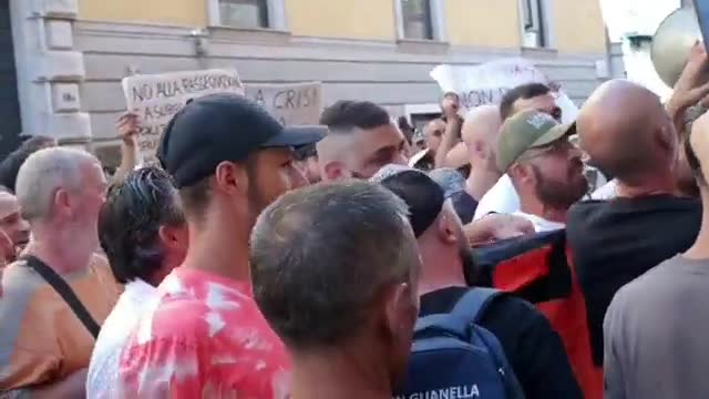 In Italy they march, burning power bills in protest of price rises.