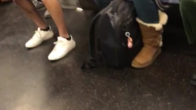 Man with yellow baby on grey back pack