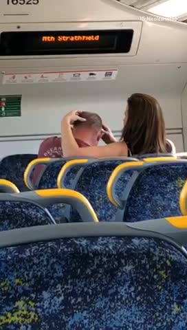 Brunette woman giving red shirt man head massage
