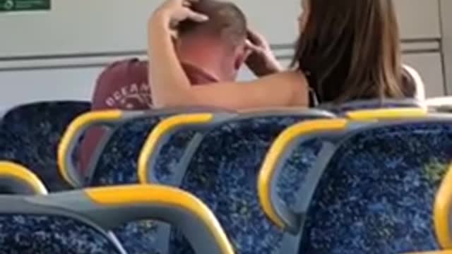 Brunette woman giving red shirt man head massage