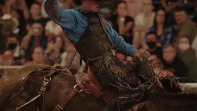 A Man Bronc Riding