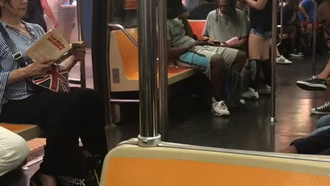 Woman braids hair person sitting down