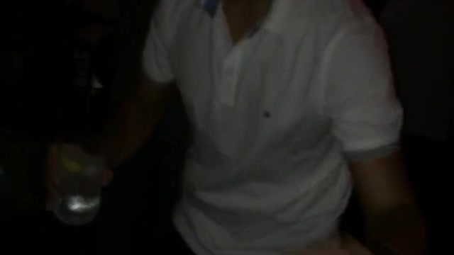 Guy white shirt dancing and holding drink