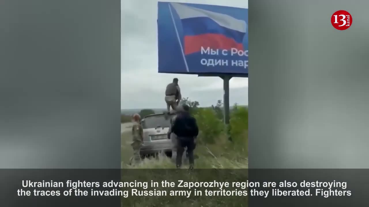 This is how Ukrainian fighters tear down Russian posters in liberated territories