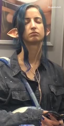 Girl elf blue hair ears sleeping on subway train