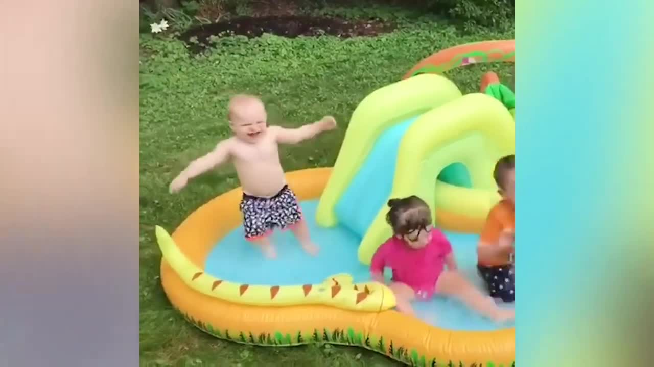 Baby's Falls over laughing