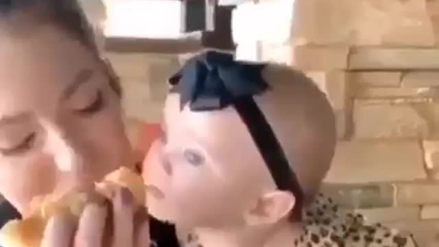 Cute baby loves food