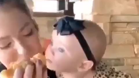 Cute baby loves food