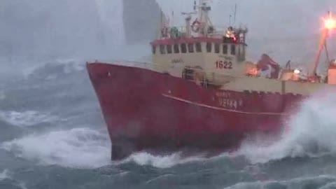 The fishing vessel is battling the waves