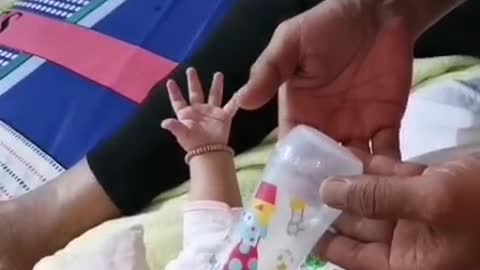 Father give milk for baby