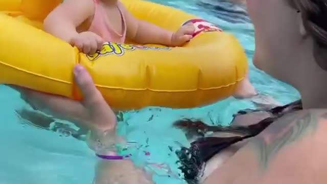 Cute baby in swimming pool