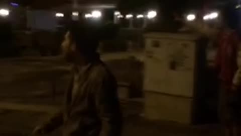 Multiple guy about to fight and one guy runs