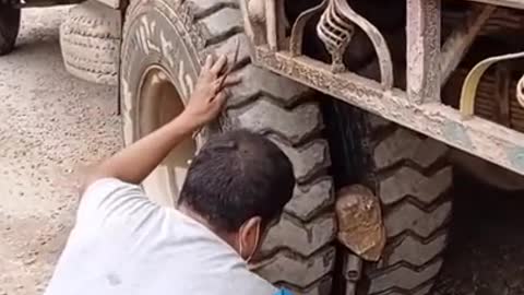 removing an stuck rock stone on truck