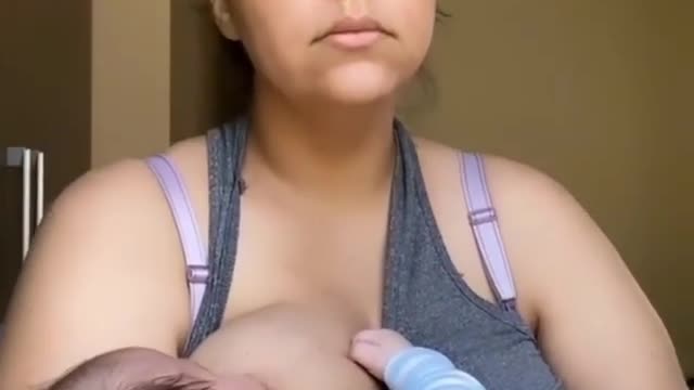 A Mother getting her baby to Sleep