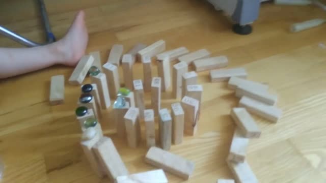 Chain reaction of wooden cubes.